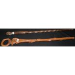 An African carved hardwood walking stick;