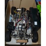 A radio controlled Tamiya Subarubrat Off Road car, 1/10th scale, chassis only, controller,