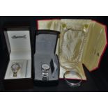 A lady's Ingersoll plated wristwatch, boxed; another Christian Lars, boxed; a silver hinged bangle,