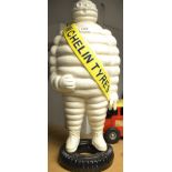 Advertising - a large reproduction cast iron model, Michelin Tyre Man, standing on a tyre,