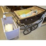 Toys and Juvenalia - a 1930's Golden Ace doll's pram; a 1950's doll's wood and metal folding cot;