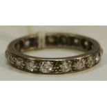 A white metal full eternity ring set with 19 round diamonds approx. 5pts each, 2.