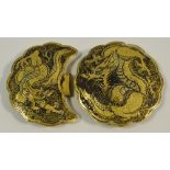 An oriental gilt buckle, decorated with ferocious dragons, embossed marks to verso.