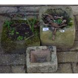 A miniature Derbyshire gritstone trough; another two,larger,