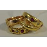 An 18ct Gold Gypsy Ring set with two rubies and a diamond chip,