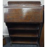 A 1940's oak students bureau, fall front over three shelves.