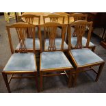 Six oak dining chairs, shaped top rail, pierced vasular splat, drop in seat,