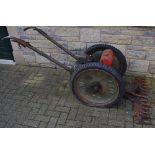 An Allen power scythe, petrol engine, finger bar mower.