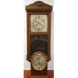 An oak wall clock, c.1930; an oak 8 day mantle clock.