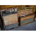 A Rococo style gilt metal wall mirror; another; a mahogany framed mirror.