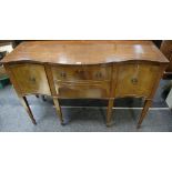 A mahogany reproduction serpentine sideboard, crossbanded top, two drawers flanked by cupboards,