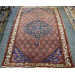 A Kurdish hand woven woolen rug, geometric designs in hues of the taupe,