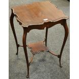 An Edwardian mahogany shaped occasional table, circa 1910.