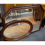 An Edwardian mahogany oval wall mirror,