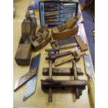 A vintage beech and brass plough plane; a Marple M60A wood carving set,