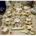 A Royal Albert Country Rose part tea service for four, including teapot, teacups, saucers,