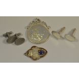 A 1921 American silver dollar pendant, a pair of engine turned cufflinks, another pair,