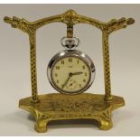 A late 19th century brass pocket watch stand