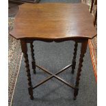 An oak shaped occasional table, barley twist legs, c.
