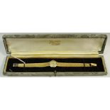 A 9ct gold lady's verity watch, integral strap, 17 ruby incablock movement, gross weight 21.1g.