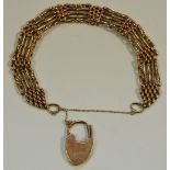 ****WITHDRAWN****A 9ct rose gold gate bracelet with heart shaped padlock, stamped 9, 18.7g.