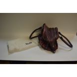 A Dolce and Gabbana Lily purple leather handbag.