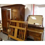 A Regency style mahogany triple wardrobe, outswept cornice, fluted frieze,