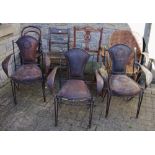 Salvage - three early 20th century embossed leather and wrought iron chairs; another peacock style;