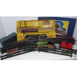 Hornby - an O' Gauge clockwork locomotive, 0-4-0 and tender, rolling stock,