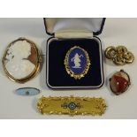 An early 20th century large cameo brooch depicting a Roman goddess with a ram,