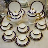 A Coalport Coffee and dinner service for six, comprising blue banded wavy edge dinner plates,