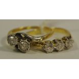 An 18ct Gold & Platinum set ring, illusion set with two diamonds on a twist,