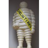 Advertising - a large reproduction cast iron door stop, of The Michelin Tyre Man, standing,