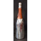 A contemporary silver plated and wooden novelty cocktail shaker, in the form of a Champagne bottle,