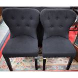 A pair of contemporary wingback side chairs,