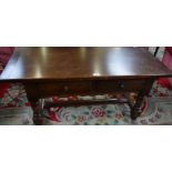 A 20th century oak coffee table, rounded rectangular top above a pair of frieze drawers,