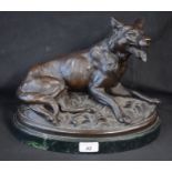 French School, after, a bronzed model, of a hound, oval base, 32.