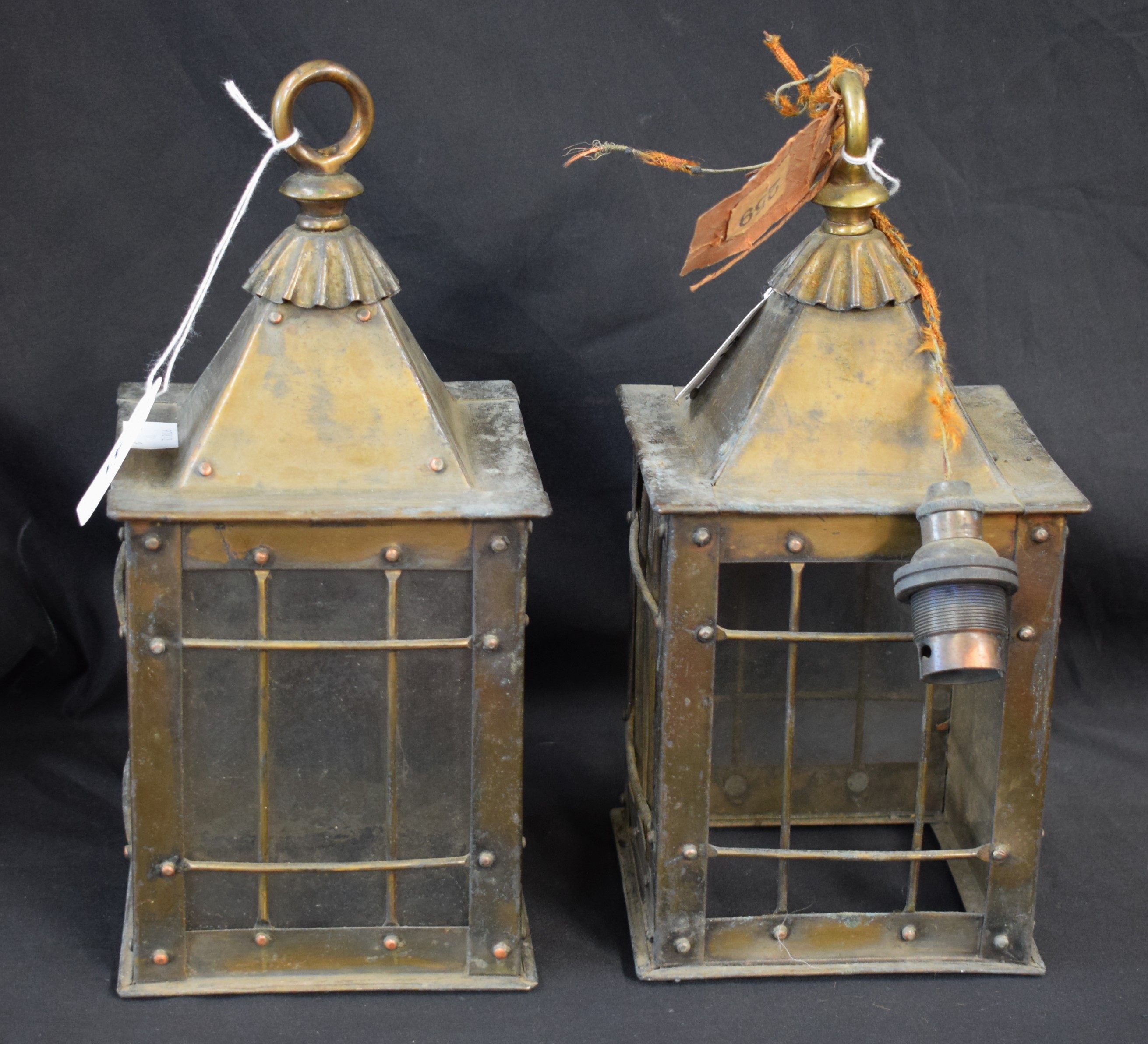A pair of early 20th century Arts and Crafts style brass hanging lanterns (2)