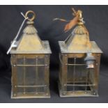 A pair of early 20th century Arts and Crafts style brass hanging lanterns (2)