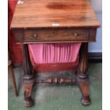 A 19th century rosewood work table, rectangular top above a frieze drawer and basket undertier,