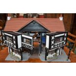 A hand built model public house cottage, The Coach and Horses, Turnpike,