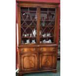 A reproduction mahogany bookcase,