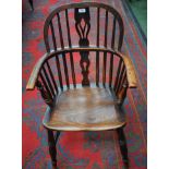 A 19th century elm Windsor elbow chair