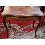 A 19th century mahogany serpentine card table, hinged top enclosing a baize lined playing surface,