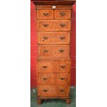 A 20th century walnut and mahogany chest on chest,