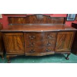 A 20th century mahogany bowed breakfront sideboard,