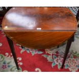 A 19th century mahogany Pembroke table, elliptical drop leaf top above a pair of frieze drawers,