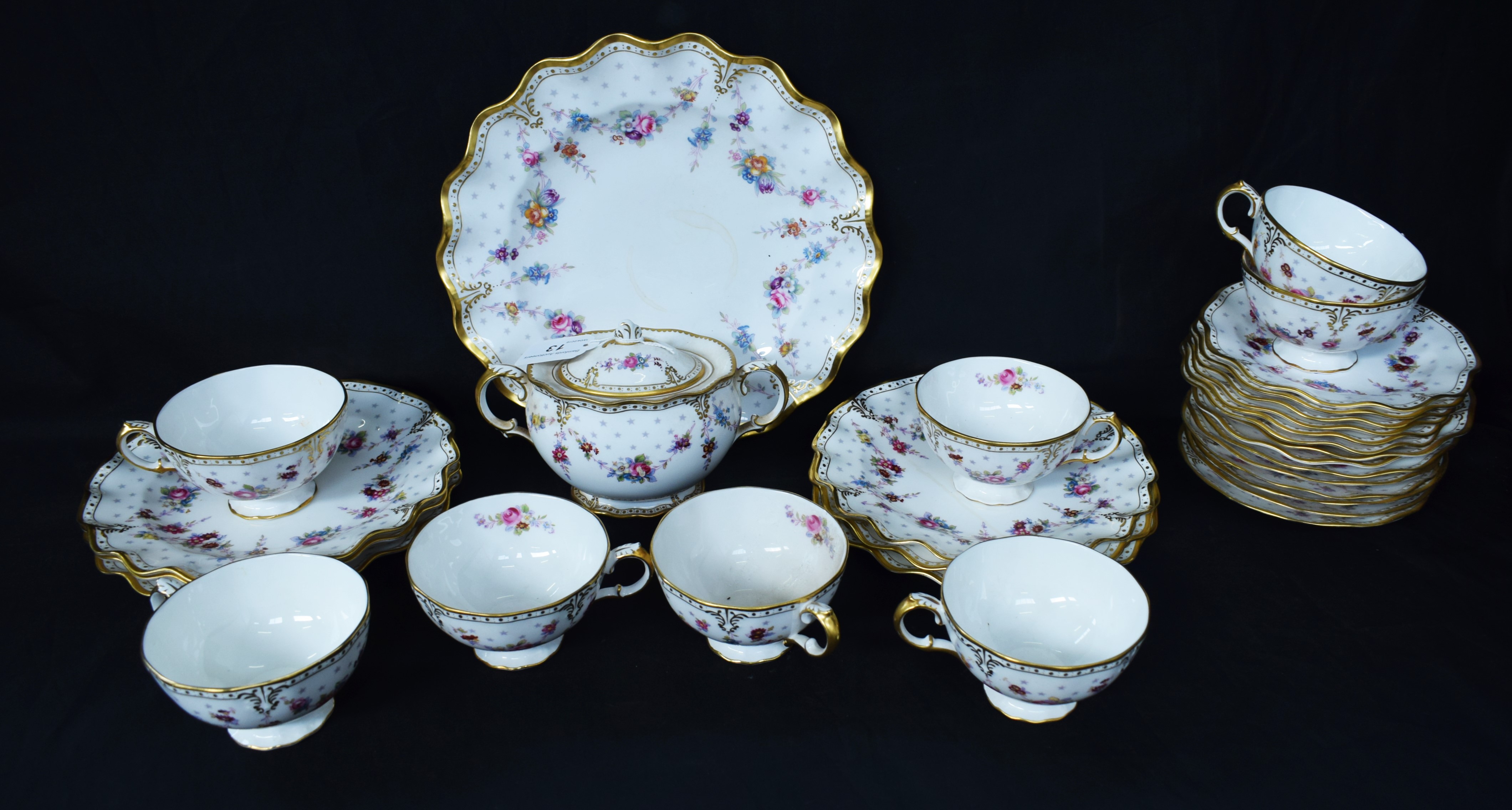 A Royal Crown Derby Royal Antoinette pattern part tea set including sugar bowl, cups, side plates,