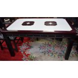 A contemporary dining table, rounded rectangular reconstituted marble top, rounded square legs,