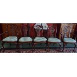 A set of eight reproduction mahogany dining chairs,